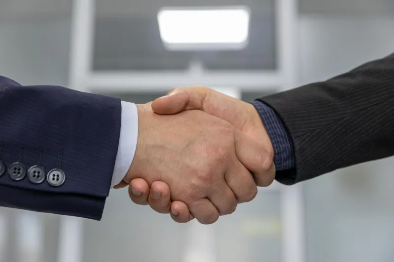 Before the Boardroom, the Handshake Belonged to a Very Different Kind of Deal